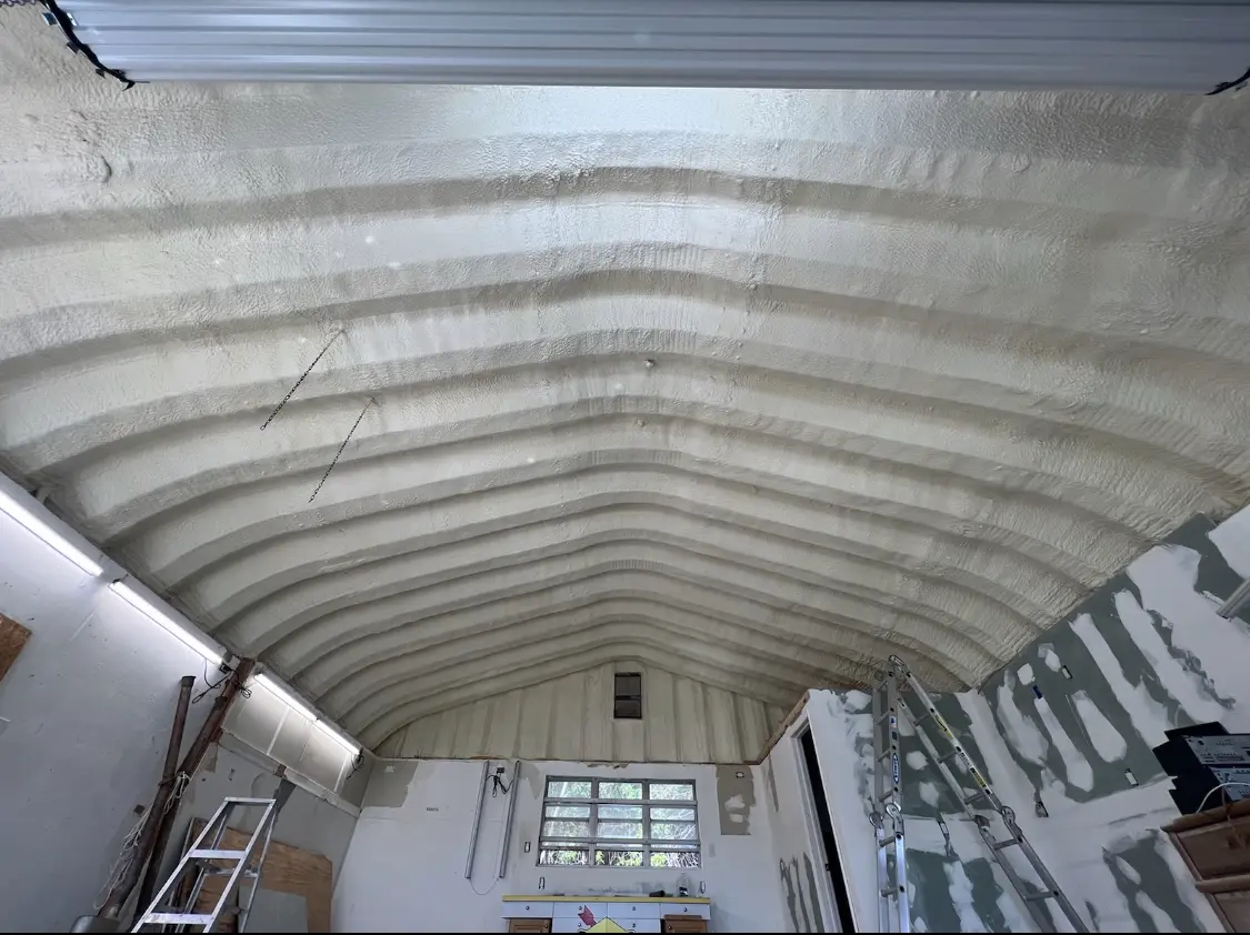 Spray polyurethane foam applied to the underside of a metal roof deck in Fayetteville